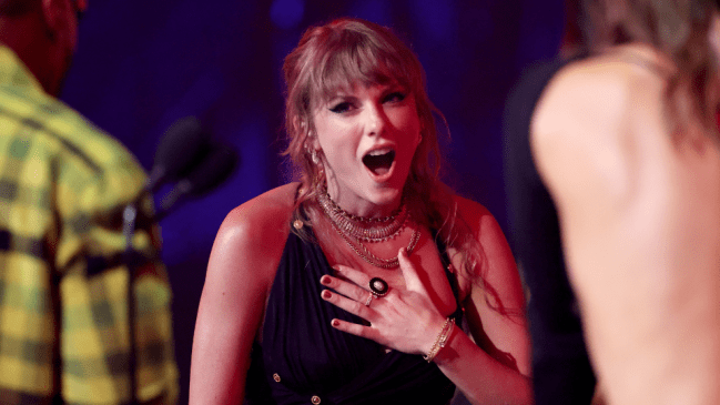 Taylor Swift responds to rumors she's dating Travis Kelce.